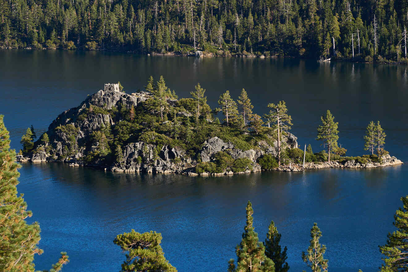 an island with a tea house on it in the middle of a lake